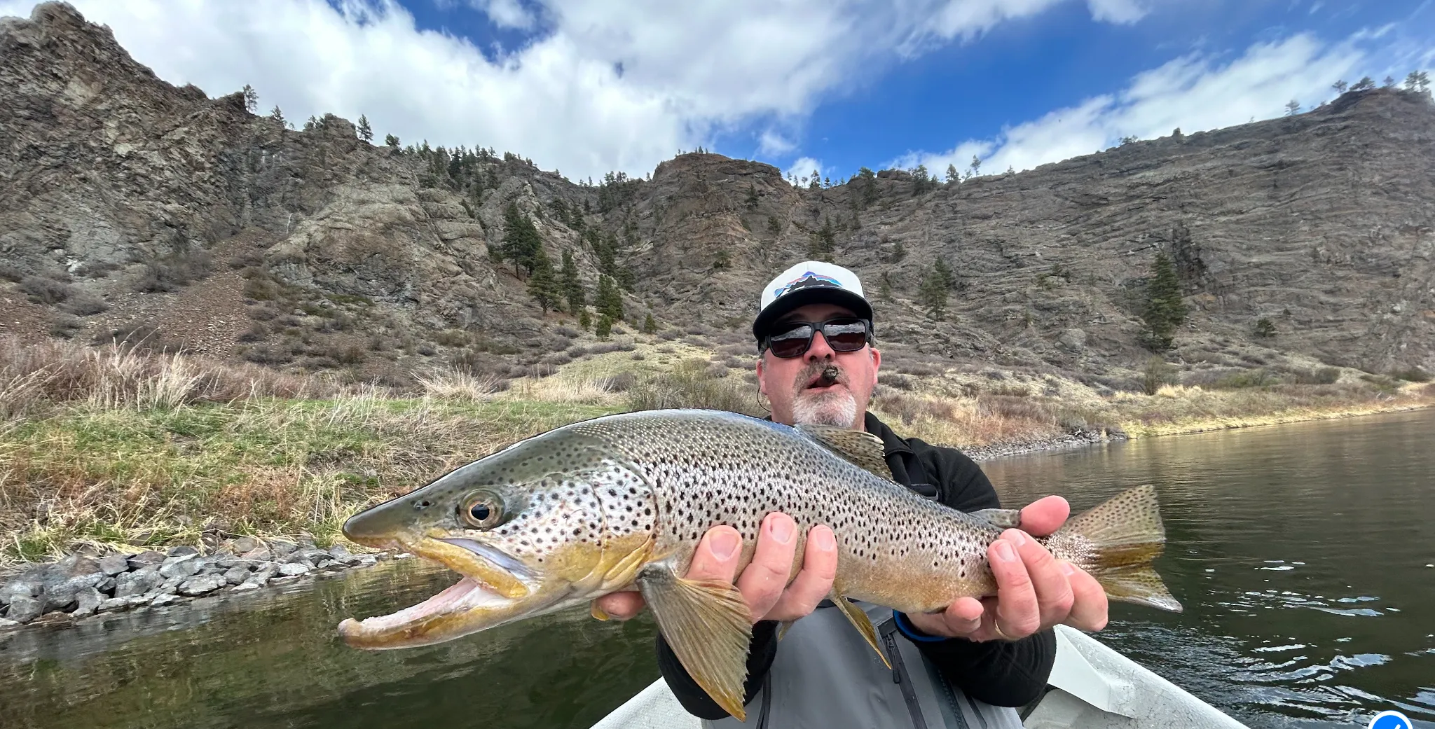 Small Montana side channel with an angler wading